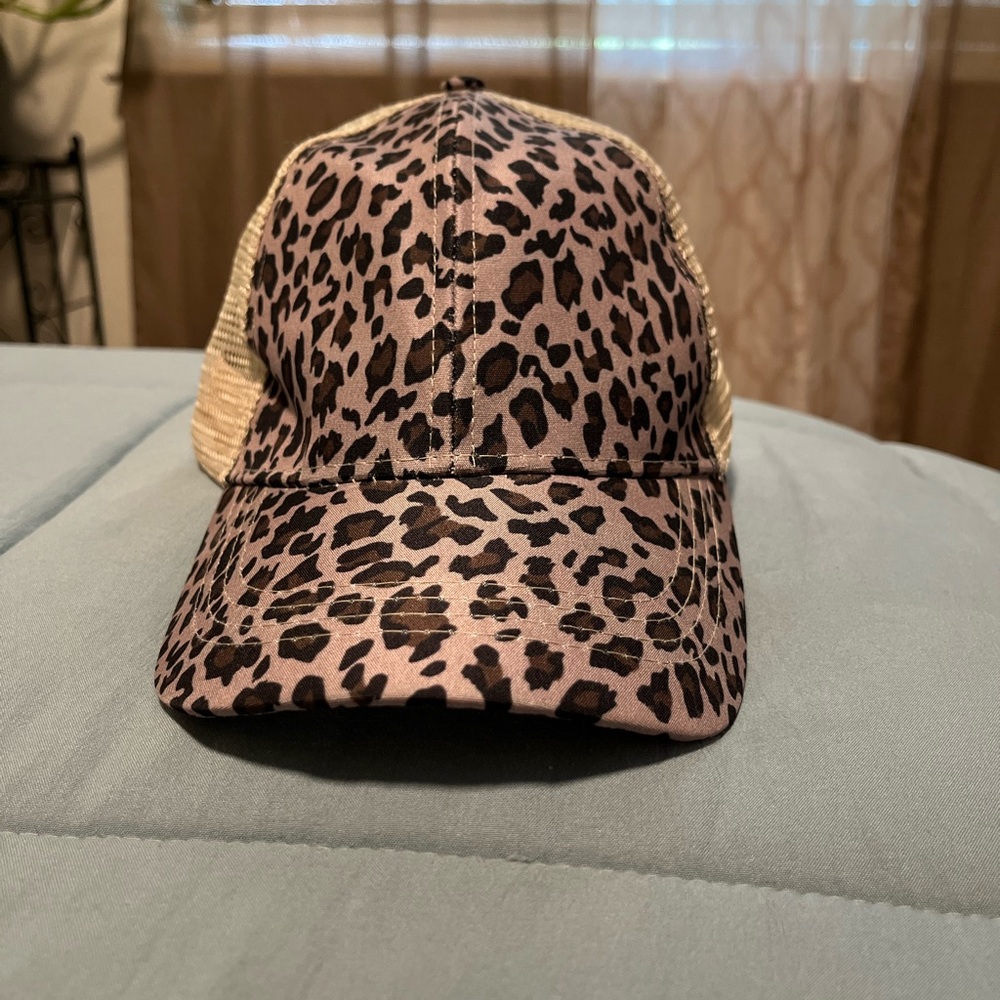 Women’s Tan Mesh Trucker Hat Leopard print with ponytail opening.
